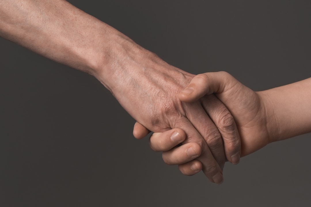 6173473cc2069d40bb48c7d2 crello 153497118 stock photo people holding hands p 1080