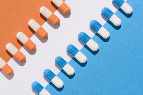 61d984eabc85dc17d4c08ba7 crello 194195622 stock photo top view blue orange pills p 500