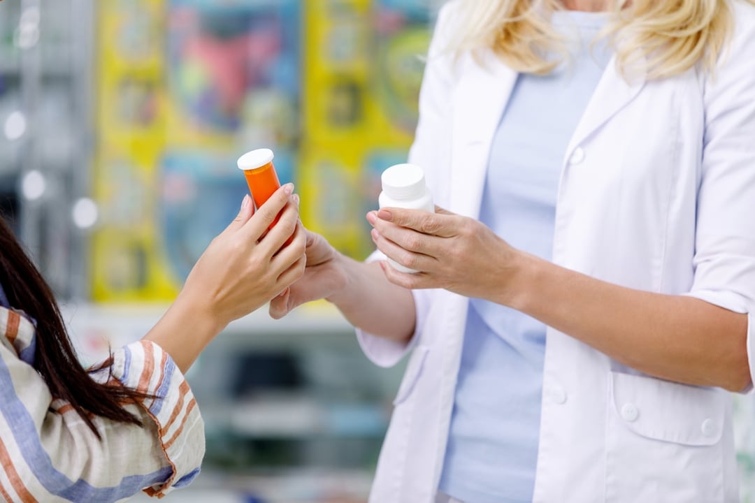 61dee5f3a4a063889bdf6a32 crello 169725354 stock photo pharmacist consulting customer in drugstore p 1080