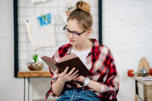 625e08d2b7e003f49d314d02 VistaCreate 254317330 stock photo curious teenage kid glasses checkered p 500