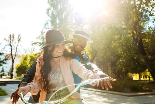 626c6d72a6212235fa6a4c94 VistaCreate 170104688 stock photo couple riding one bike together p 500