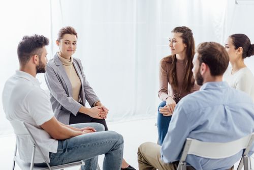 629658ba9ae5f629d066cc9d VistaCreate 253593446 stock photo people sitting circle support group p 500