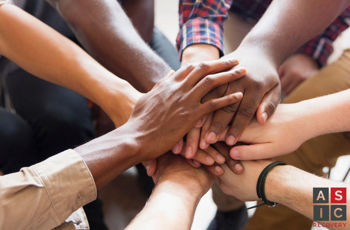 More advanced drug or alcohol addiction treatment programs, like PHP. An image of a group discussing substance abuse treatment
